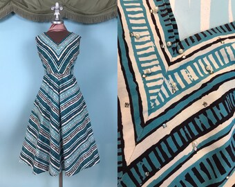 Vintage 1950s full swing dress with rainbow stripes in chevron style pattern dolman sleeve