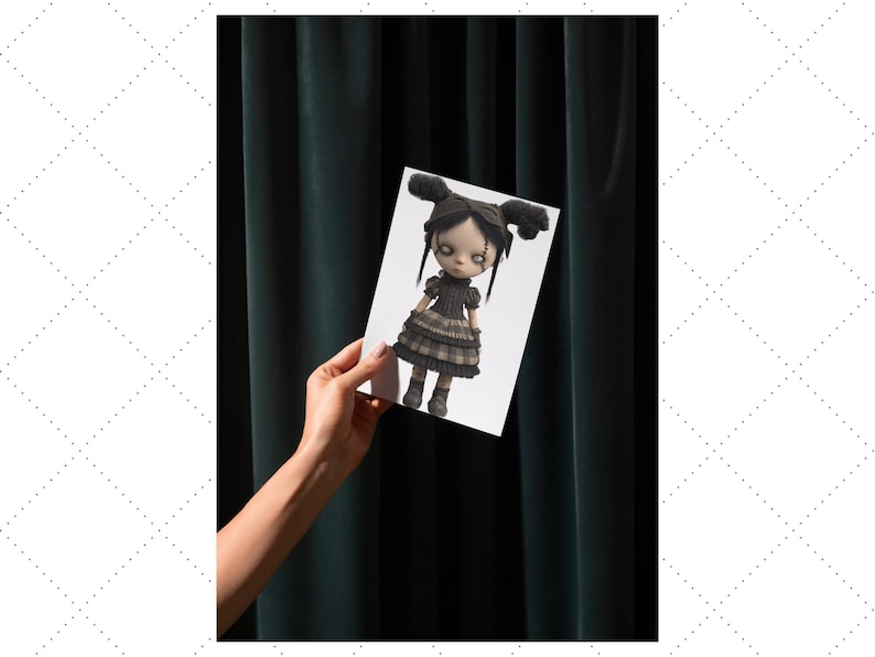 May include: A doll illustration on a white card held against a dark green curtain. The doll has black hair in two buns, a black dress, and grey boots. The doll's eyes are white with black details.