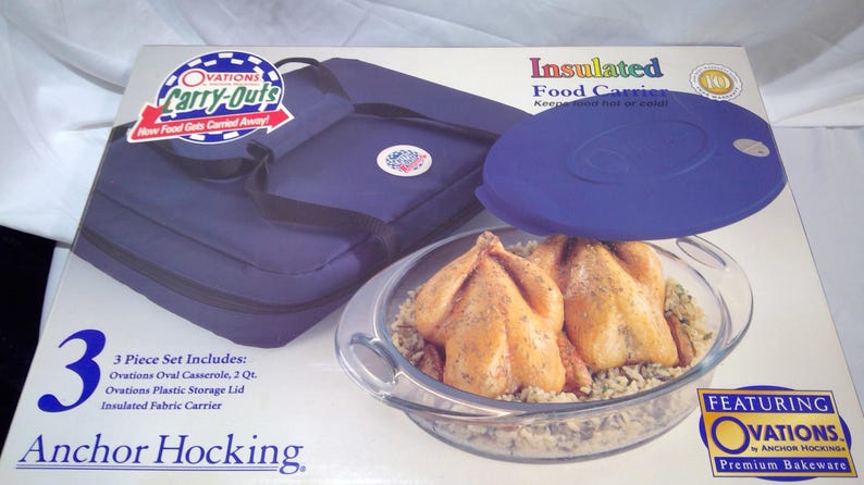 May include: A boxed 3-piece food carrier set by Anchor Hocking. The set includes an oval casserole, plastic lid, and an insulated fabric carrier. The carrier is navy blue, and the casserole contains cooked chicken.