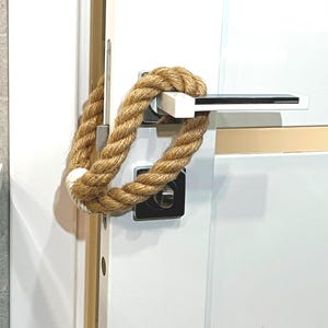 Fermaporta - Fermaporta in corda di iuta con accenti bianchi - stile naturale per la tua casa
