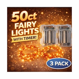 May include: A 3-pack of fairy lights with a timer. The image shows two spools of warm white fairy lights, two battery packs, and the text "50ct Fairy Lights With Timer!" in gold lettering. A blue oval sticker reads "3 PACK".