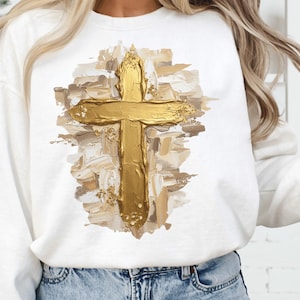Gold oil brushstroke cross with messy neutral paint strokes and faux glitter accents, Christian PNG.