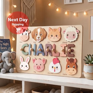 May include: A wooden puzzle board featuring the name CHARLIE in large letters, surrounded by illustrations of a cow, dog, cat, sheep, duck, pig, chicken, and horse. Each animal face is a separate wooden piece with a small knob for easy handling.