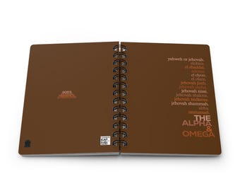 May include: A brown spiral bound notebook with the words "The Alpha & Omega" in a gradient of orange, red, and brown. The notebook also includes a list of names for God in Hebrew and English.