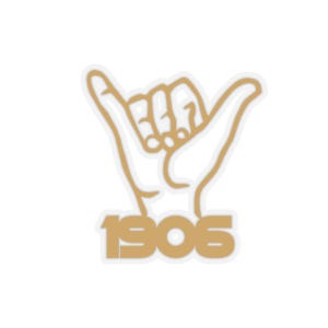 May include: A sticker featuring a hand gesture with the thumb and pinky extended, in a gold outline. The number "1906" is below the hand in a matching gold color. The background is white.