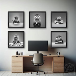May include: A set of four black and white framed prints featuring a cartoon otter in different office settings. The otter is holding a coffee cup, using a stapler, writing on a notepad, and using a printer. The prints are hanging on a white wall above a desk with a computer monitor, a chair, and a wooden desk.