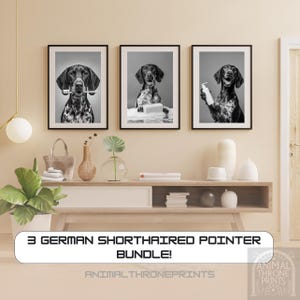 May include: Set of three framed black and white prints featuring German Shorthaired Pointers. One dog holds a toothbrush, another is surrounded by towels, and the third holds a bottle. The text reads "3 GERMAN SHORTHAIRED POINTER BUNDLE!" and "ANIMAL THRONE PRINTS".