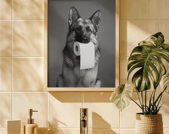 May include: Black and white photo of a German Shepherd dog holding a roll of toilet paper in its mouth. The dog is looking at the camera.