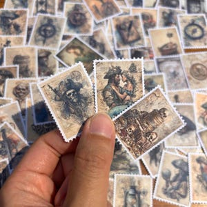 May include: A collection of vintage-style pirate-themed stamps. The stamps feature illustrations of pirates, skulls, ships, and romantic scenes. The stamps have a sepia tone, giving them an aged appearance. The stamps are small and rectangular with a white border.