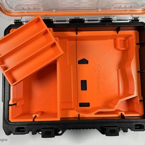 May include: An open orange and black hard plastic case with a removable orange tray with three compartments. The case has a black latch and a clear plastic lid.