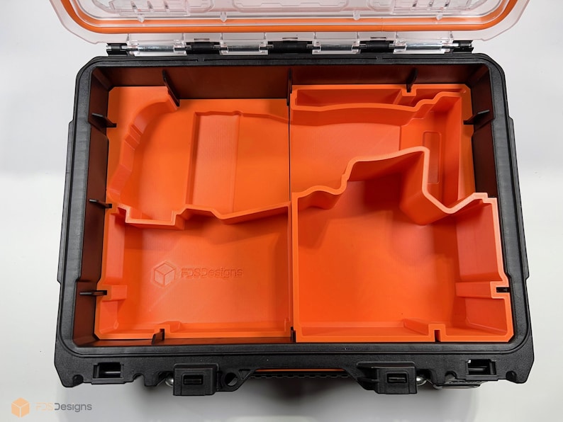 May include: An orange foam insert for a black tool case. The insert has two compartments, one larger than the other. The insert is labeled "Foxfire Designs".