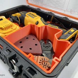 May include: A black and orange tool case with a yellow and black DeWalt oscillating tool, a battery, sanding pads, and various cutting blades.