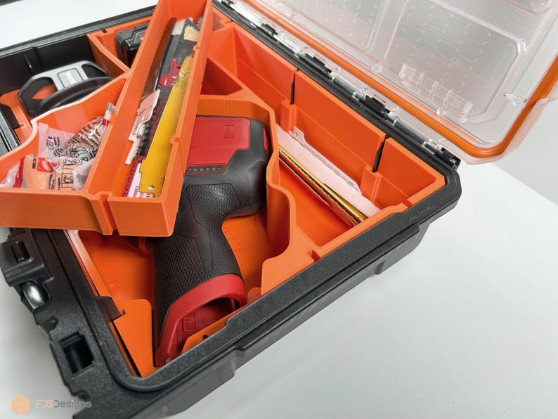 May include: An orange and black tool case with a red and black power tool inside. The case has multiple compartments for organizing tools.