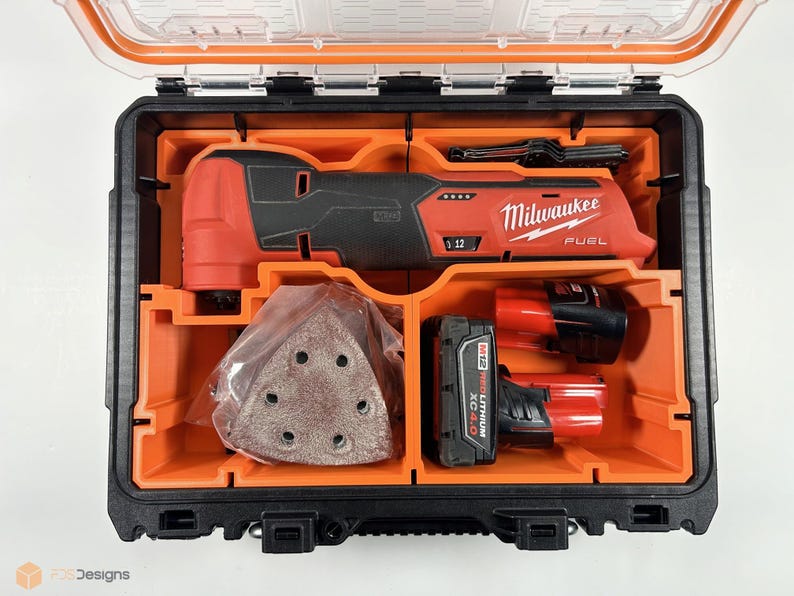 May include: An open black and orange tool case containing a red Milwaukee FUEL oscillating tool, a battery, and sanding pads.
