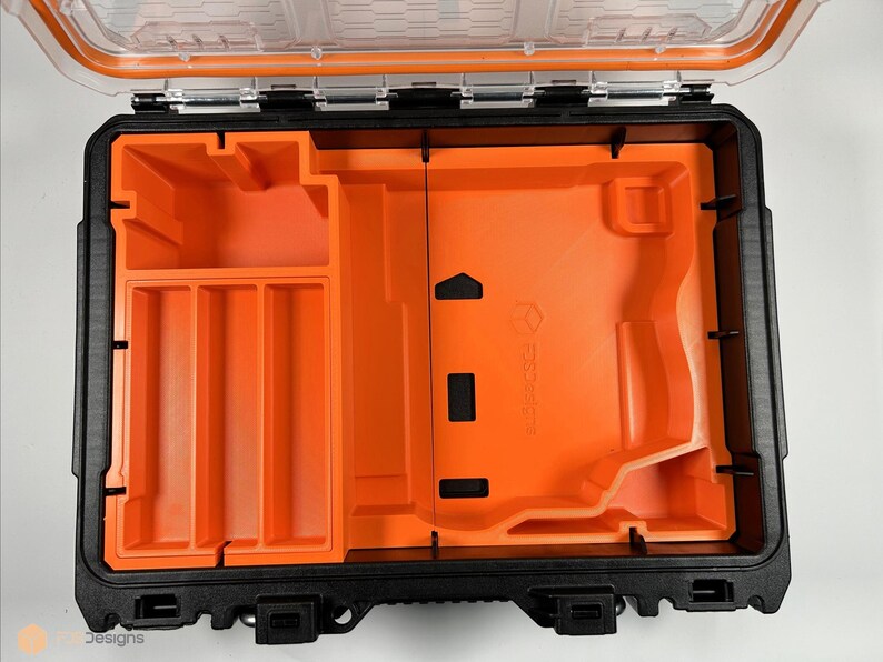 May include: An open black and orange hard plastic case with a removable foam insert. The foam insert has multiple compartments for organizing tools and other small items.