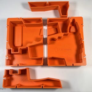 May include: Orange foam insert with multiple compartments for organizing tools. The insert has the text "F33 Designs" printed on it.