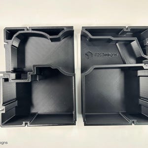 May include: Two black plastic storage boxes with compartments. The boxes are designed to hold small items and have the text "FDS Designs" printed on the side.
