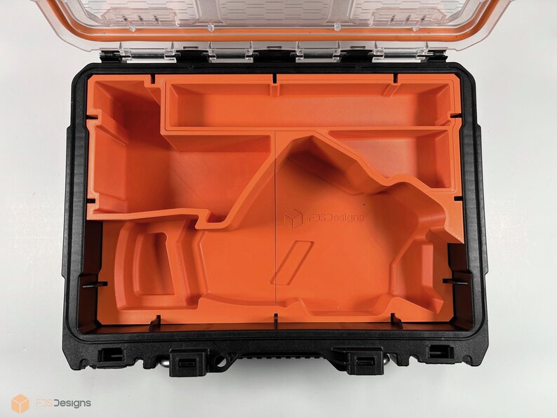 May include: An open black and orange tool case with a custom foam insert. The foam insert has a cutout for a tool, and the case has a clear plastic lid.