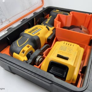 May include: A black and yellow DeWalt 20V MAX oscillating tool with a battery and a carrying case. The tool is in the case with the battery next to it.