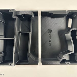 May include: Two black plastic storage boxes with compartments. The box on the right has the text "Subcase Designs" printed on the side.