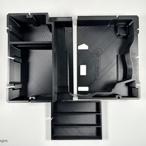 May include: Black plastic organizer with multiple compartments and a removable tray. The organizer has the word "Prototype" printed on the side.