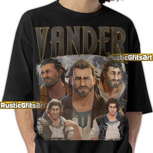 Puede incluir: Camiseta negra con un gráfico de un hombre barbudo, el nombre "VANDER" en letras doradas y múltiples imágenes del hombre con un fondo de relámpagos. El texto "RusticGfitsArt" también es visible en la camiseta.