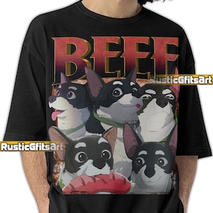 Puede incluir: Camiseta negra con un gráfico de varios perros de dibujos animados con pelaje blanco y negro, con collares verdes. La palabra "BEEF" está impresa en letras grandes de color dorado en la parte superior. La camiseta tiene el texto "RusticGiftsArt".