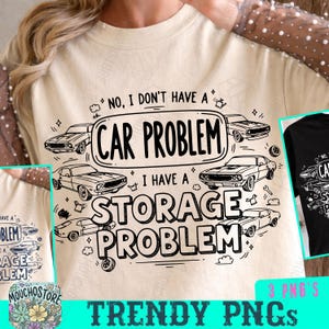 May include: Beige t-shirt with a black and white graphic design. The design features classic cars and the text "NO, I DON'T HAVE A CAR PROBLEM, I HAVE A STORAGE PROBLEM."
