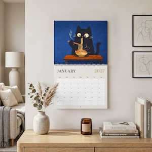 Unique gift for cat lovers featuring original black cat illustrations and spacious monthly layouts for planning throughout the year.