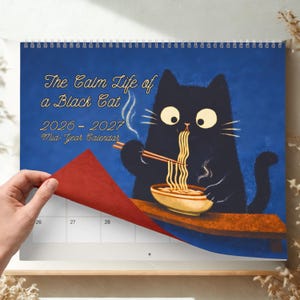 Japanese aesthetic wall calendar with charming black cat scenes, clean layout and generous writing space for everyday planning.Mid-year calendar July 2026 to June 2027.
