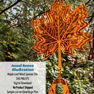 May include: A translucent amber maple leaf wind spinner made from 1/8 inch cast acrylic. The spinner is hanging from a tree branch. The image text reads: "Jewel Renee Illustration Maple Leaf Wind Spinner File SVG PNG EPS Digital Download No Product Shipped Sample cut on Glowforge Plus from Custom Made Better's 1/8" Translucent Amber Cast Acryuc"
