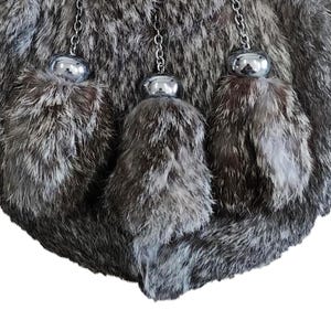 Soft grey rabbit fur texture of the Scottish sporran shown in a detailed close-up shot.