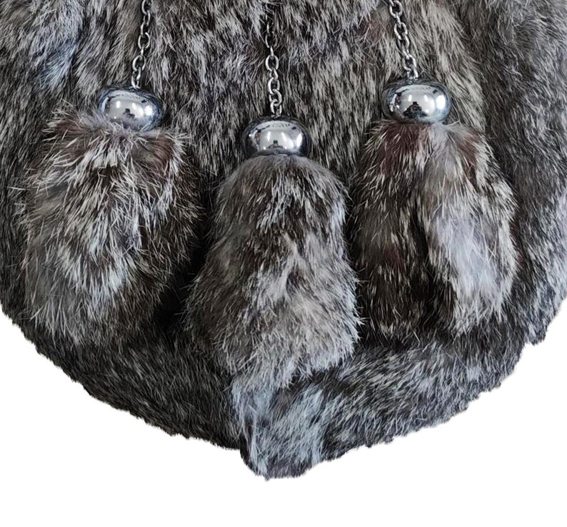 Soft grey rabbit fur texture of the Scottish sporran shown in a detailed close-up shot.