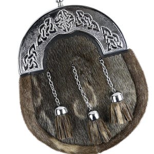 Close-up of brown rabbit fur sporran with intricately engraved chrome Celtic cantle.
