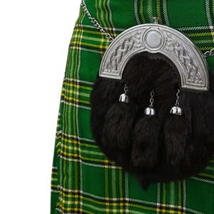 Black Traditional rabbit fur sporran with chrome Celtic cantle worn with a tartan kilt.