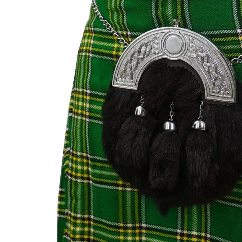 Black Traditional rabbit fur sporran with chrome Celtic cantle worn with a tartan kilt.