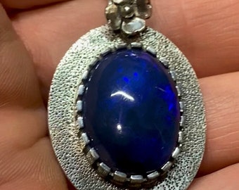 Large lightning ridge black Opal Pendant with sterling CastellatedBezel and fabricated flower