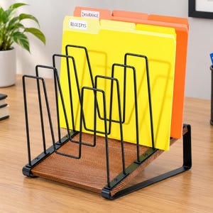 May include: A desktop file organizer featuring a slanted brown wood-grain base and a black metal wire frame. The organizer holds yellow and orange file folders with white labels reading Receipts and Insurance, providing a structured storage solution.