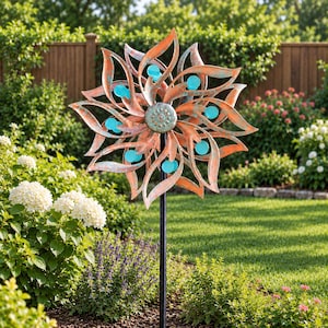 May include: A metal garden wind spinner featuring a multi-layered, flower-shaped design with copper-toned petals and a weathered teal patina. The center is a textured circular medallion, accented by small, bright turquoise circular discs.