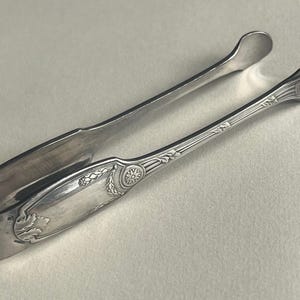 Silver plated sugar tongs by Christofle