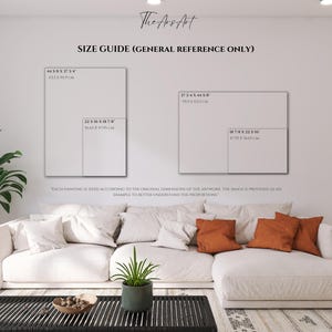 K&ouml;nnte beinhalten: Ein Gr&ouml;&szlig;enleitfaden f&uuml;r Kunstwerkdimensionen wird an einer wei&szlig;en Wand angezeigt. Der Leitfaden enth&auml;lt rechteckige Umrisse mit Ma&szlig;en in Zoll und Zentimetern. Ein wei&szlig;es Ecksofa mit orangefarbenen Kissen und ein schwarzer Couchtisch befinden sich im Vordergrund.