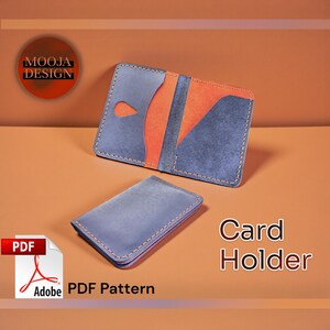 May include: Two leather card holders. One is open, revealing an orange interior, the other is closed. Both are blue with orange accents and stitched edges. The text "Card Holder" is visible. The image also includes a PDF pattern.
