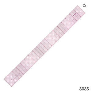 May include: A clear, pink, grid-marked ruler, ideal for sewing and crafting. The ruler is rectangular and features both inch and metric measurements. The ruler is approximately 24 inches long.