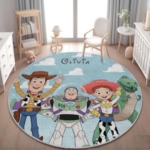 May include: A round area rug featuring a light blue sky background with white clouds and the name Olivia printed in dark text. The rug displays cartoon characters including a cowboy, a space ranger, a cowgirl, and a green dinosaur.