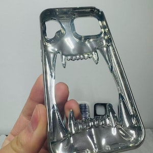 3D Hollow Fanged Skull iPhone Case – Metallic Silver & Black Creative Protective Cover for Gothic and Punk Style image 4