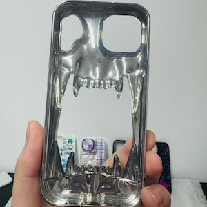 3D Hollow Fanged Skull iPhone Case – Metallic Silver & Black Creative Protective Cover for Gothic and Punk Style image 6