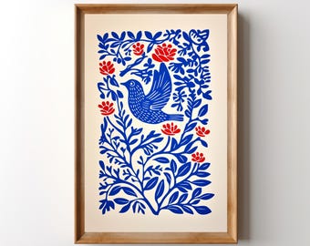 May include: A framed art print featuring a central blue bird in flight surrounded by intricate blue foliage and small red flowers. The design is set against a cream-colored background and enclosed in a light brown wooden frame.