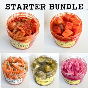 May include: A starter bundle of six jars of fermented foods, including kimchi, radish kimchi, banh mi, dill cucumber mix, and red onion. The jars are labelled with the name of the food and the brand "Mama Kitchen".