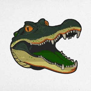May include: A green and yellow alligator head with an open mouth and sharp teeth. The alligator's eye is orange.