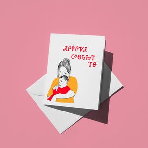 Tarjeta del Día de la Madre con silabario Cherokee: Mamá y bebé. Diseño colorido y encantador, regalo perfecto con un mensaje emotivo.